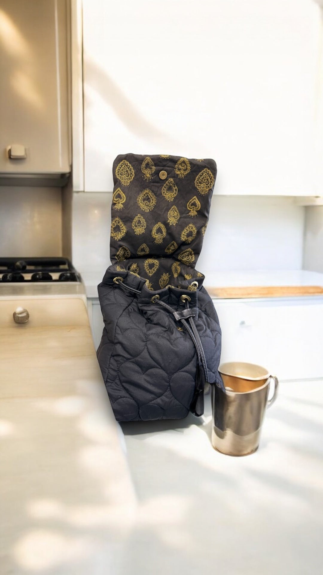 Sac à dos noir matelassé pailleté